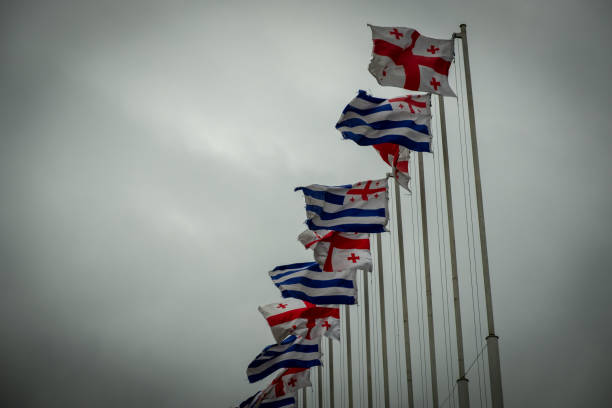istock Flags of the state of Georgia on tall posts. 1220435593