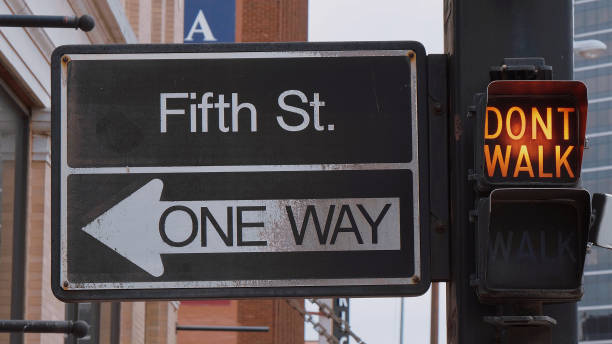 istock Old traffic light in Tulsa Downtown and One Way sign 1220435726