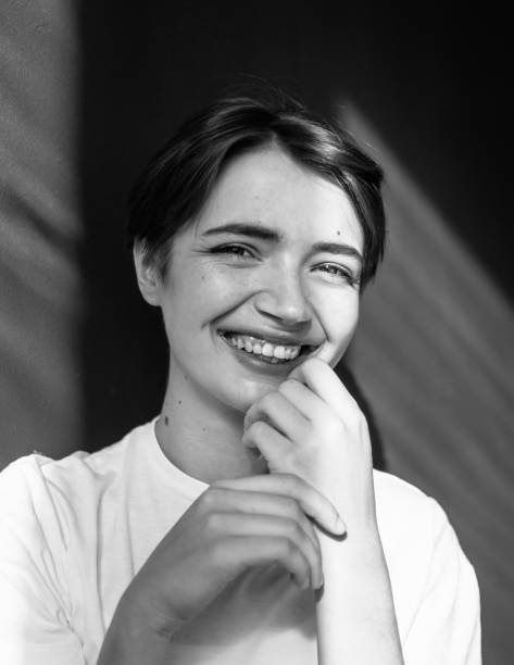 istock Young happy woman smiling at camera 1220435757