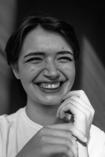 istock Young happy woman smiling at camera 1220435896