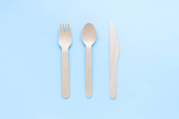 istock eco friendly disposable kitchenware utensils on blue background. wooden forks and spoons. ecology, zero waste concept. top view. flat lay 1220437683