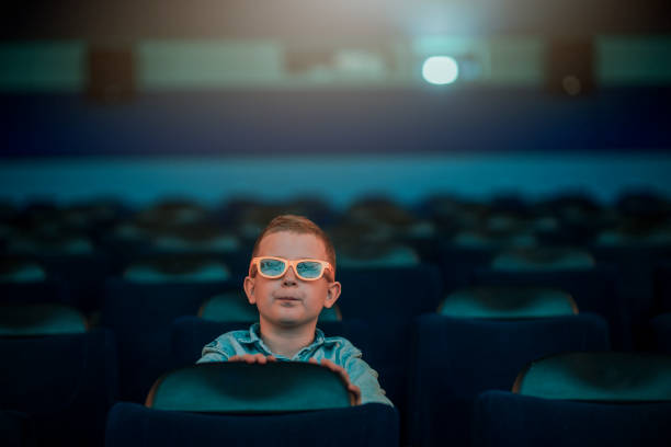 istock Little boy at the cinema 1220438116