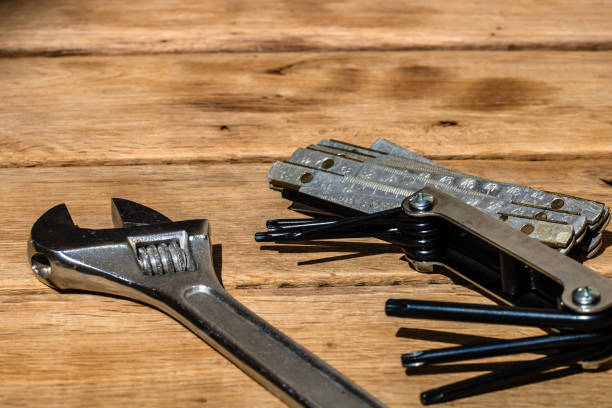 istock Tools for repair and building. Hummer, adjustable spanner, ruler. Instruments on rustic wooden table with copy space 1220438366