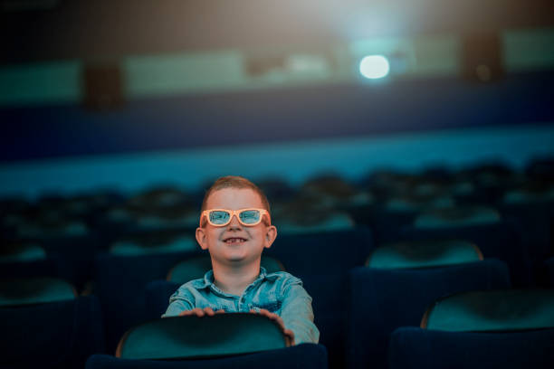 istock Little boy at the cinema 1220439159