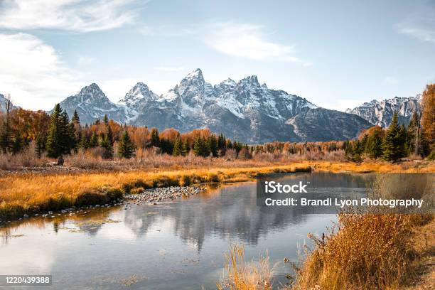 Teton Mountain Range Reflection In The Snake River At Schwabachers Landing In Grand Teton National Park Wyoming Fall Scenic Nature Landscape With Evergreen Trees And A Mountain Water Reflection Stock Photo - Download Image Now