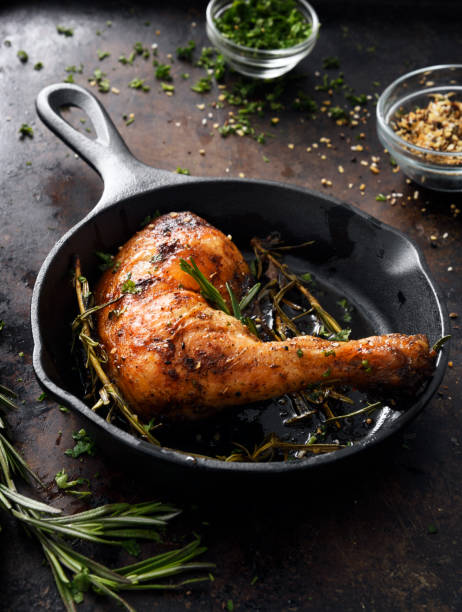 istock Chicken leg in a skillet 1220440451