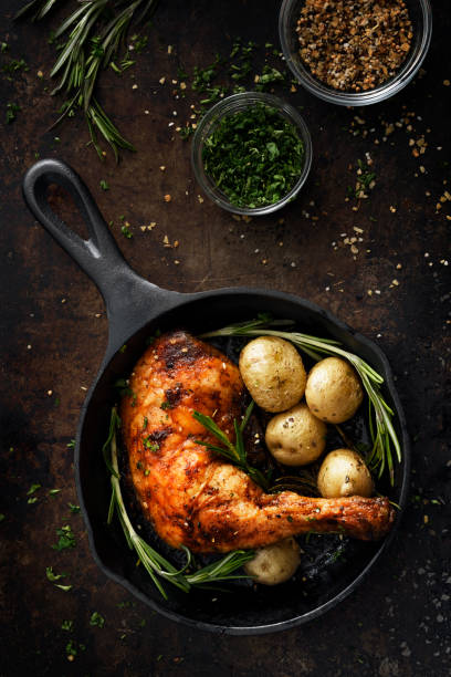 istock Chicken leg in a skillet 1220440455