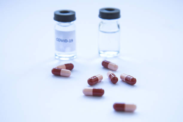 istock Coronavirus vaccine vial and pills 1220441316