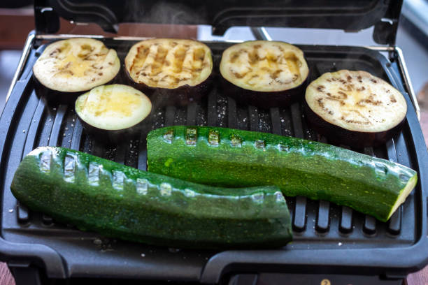 istock zucchini and eggplant cooking on electric grill 1220443206
