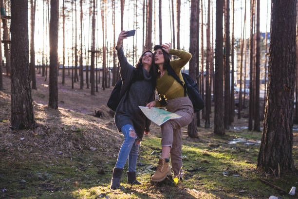 istock Two girls in the forest 1220443252