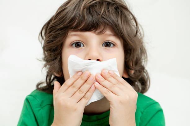 istock Sick little boy taking medicine 1220450692