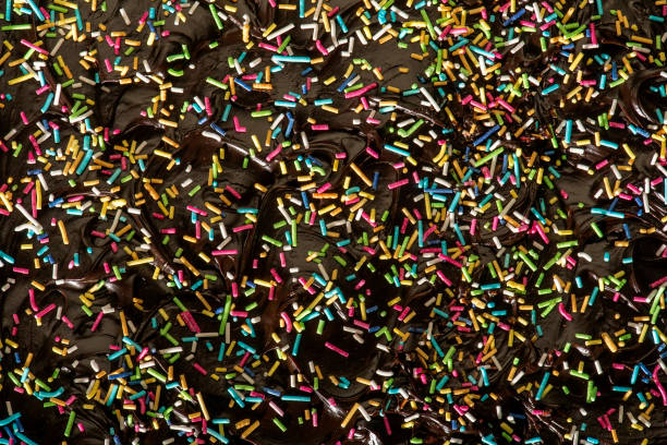 istock Small colorful candies poured on chocolate pudding 1220450704