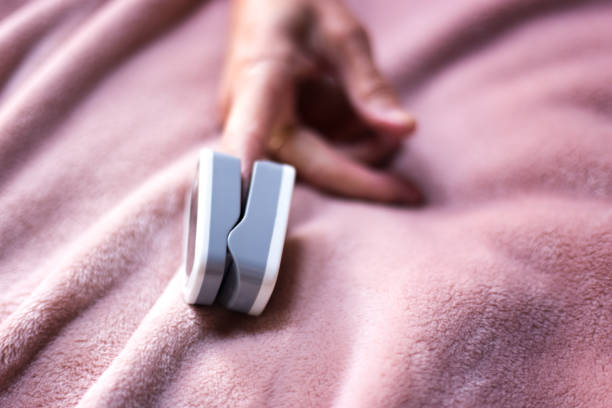istock Bed-Ridden Person with Oximeter on Finger 1220451831