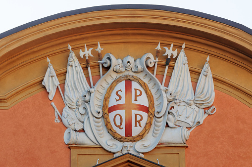 the town hall of reggio emilia (italy) with the roman effigy SPQR