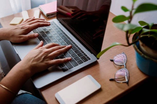 istock workspace of a girl with her hands 1220453945