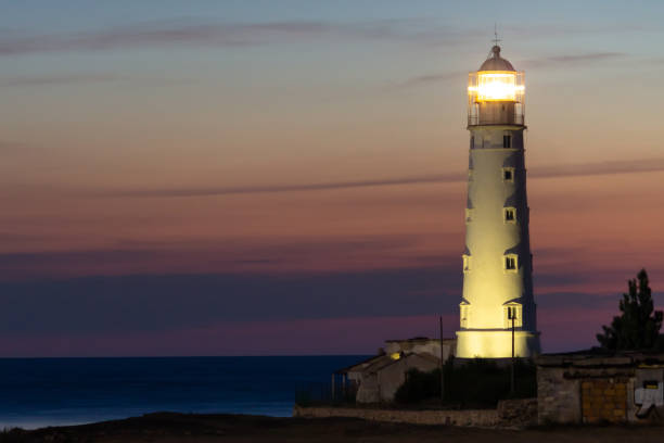 istock lighthouse against the evening sky and sea 1220454414