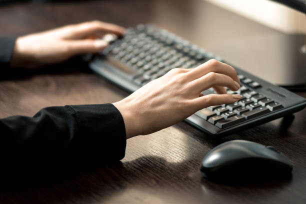 istock Remote work during quarantine. The girl works at the computer. Horizontal frame 1220455390