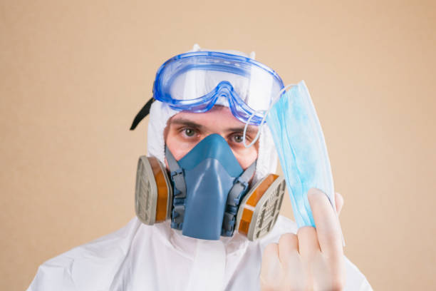 istock Doctor holds medical mask defocused. 1220455428