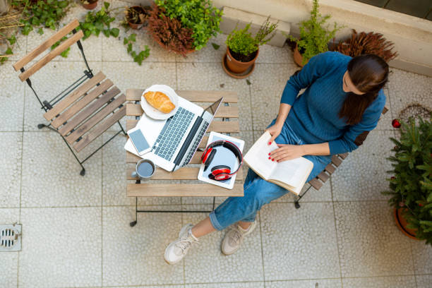 istock Beautiful young woman working from home 1220456245