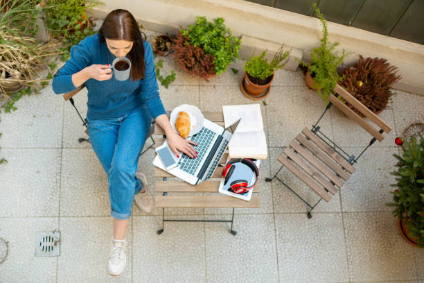 istock Beautiful young woman working from home 1220456292