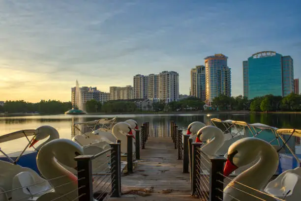 Vibrant Sunrise Over Lake Eola Park and the Orlando Skyline in Downtown Orlando Florida USA.