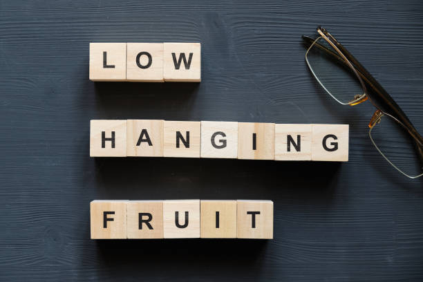 Modern business buzzword - low hanging fruit. Top view on wooden table with blocks. Top view. stock photo