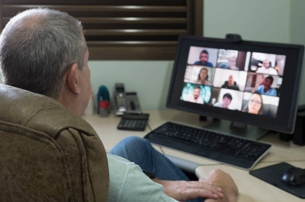 istock Adult man making conference call with friends - Focus on foreground 1220460004