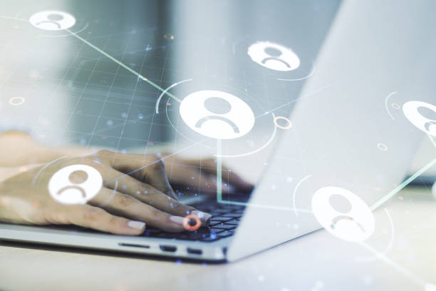 istock Double exposure of social network icons concept with hand typing on computer keyboard on background. Networking concept 1220460042