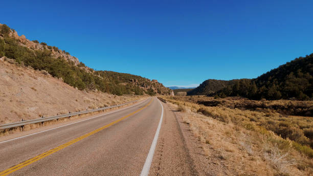 istock Endless road through the desert of Utah 1220462454