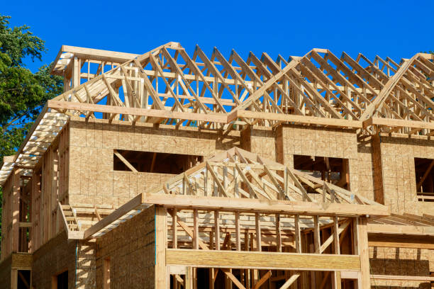 istock New construction home residential construction home framing against a blue sky 1220467135