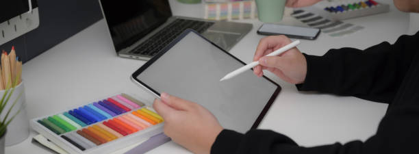 istock Side view of designer drawing on mock-up tablet with stylus pen 1220474144