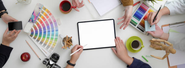 istock Designer team consulting on their project in minimal workspace 1220474208