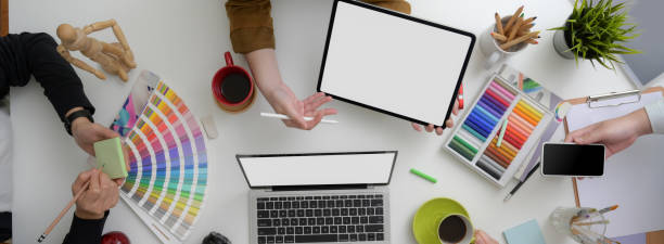 istock Designer team working together on their project in minimal workspace 1220475467