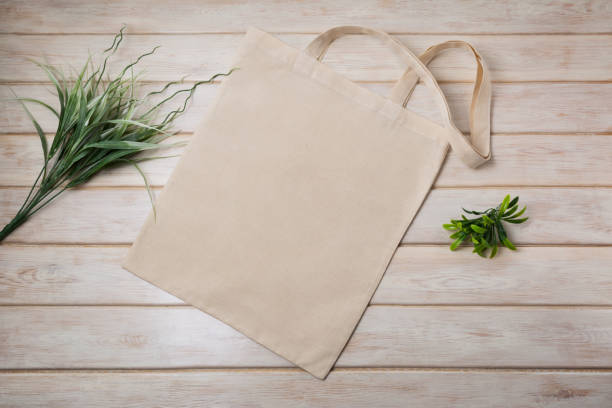 istock Tote bag mockup with green grass 1220475573