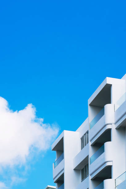 istock Fragment of white building against blue sky with copy space 1220475668