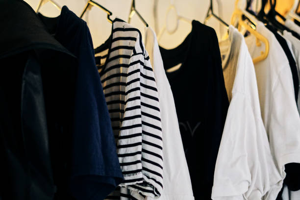 istock Shirts hanging in a wardrobe 1220477928