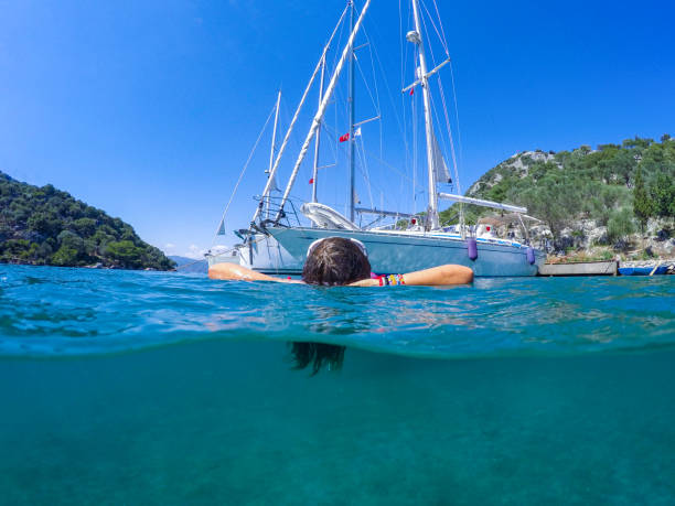 istock Woman floating in the clean sea. 1220478982
