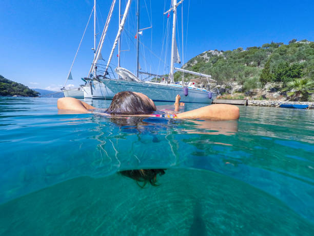 istock Woman floating in the clean sea. 1220479886