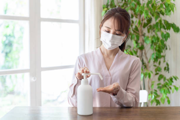istock young asian woman wearing mask 1220480740