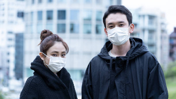 istock young asian people wearing mask 1220480831
