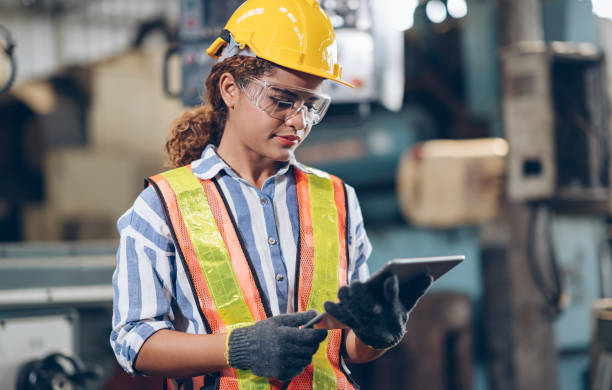 professional women  engineer checklist automated CNC in factory professional women  engineer checklist automated CNC in factory maintenance engineer photos stock pictures, royalty-free photos & images