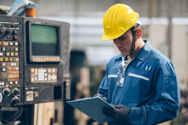 istock engineer checklist process heavy machine to automated CNC in factory 1220482517