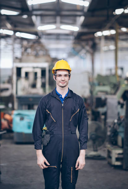 istock profession technician engineer operate heavy machine to automated CNC in factory, worker with check list 1220482539