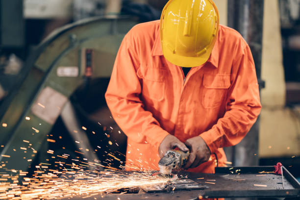 istock profession worker work Grinding steel in factory 1220482573