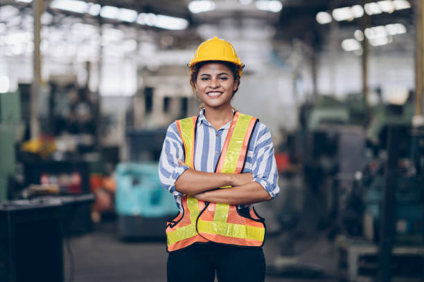 istock Smile technician engineer women arms cross  in factory 1220482580