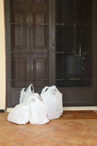 istock COVID-19 Grocery Delivery on Porch Vertical MS 1220483612