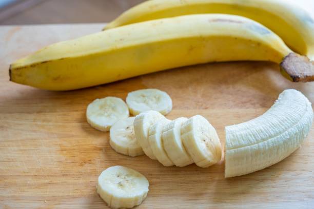 istock Slices banana on a cutting board. 1220484661