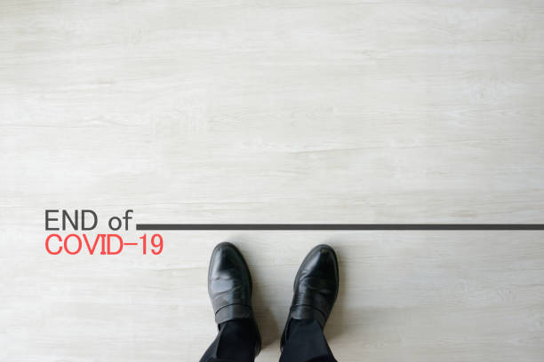 istock Business man standing on end line of coronavirus 1220486897