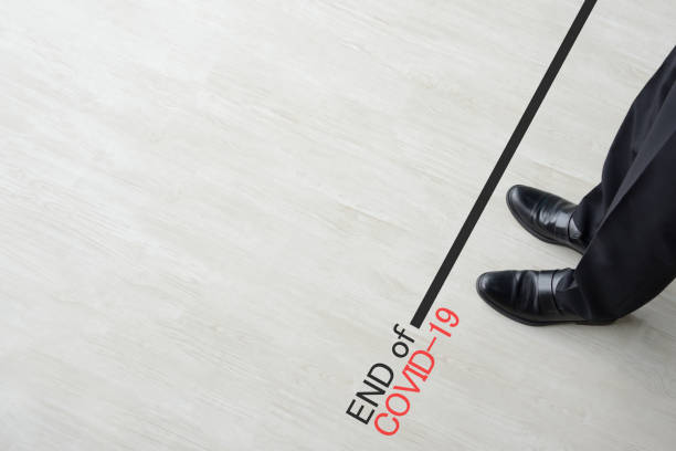istock Business man standing on end line of coronavirus 1220486925