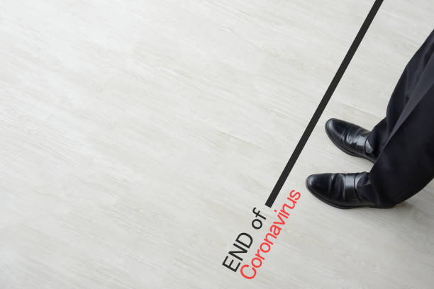 istock Business man standing on end line of coronavirus 1220486978